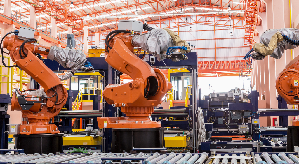 welding robots working in warehouse 