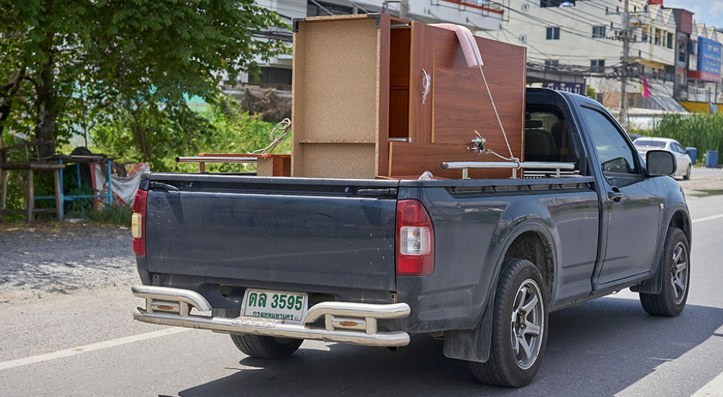 Helping people move out of their homes is a way to make extra money with your truck. 