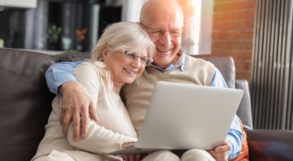old couple looking at computer